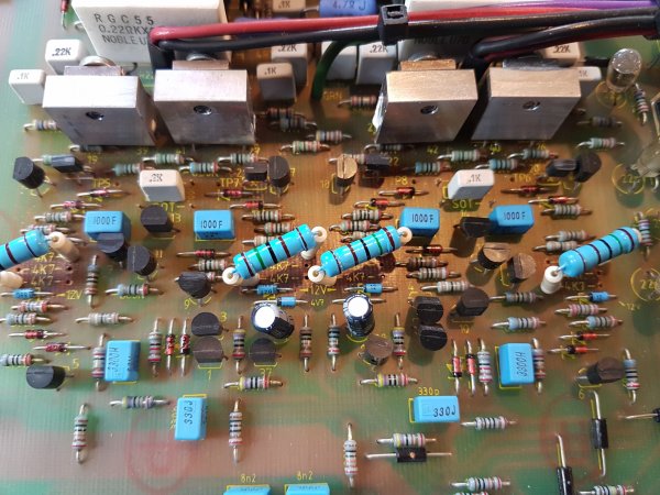 The original resistors burned into the board. 